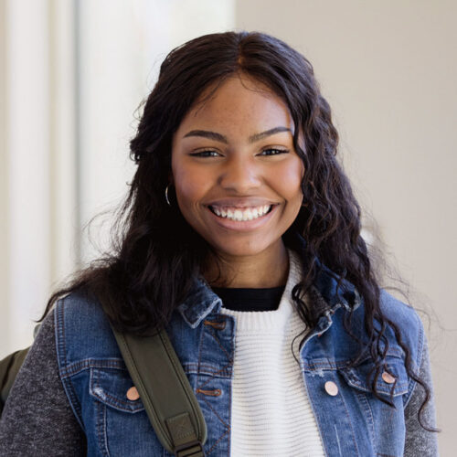 High school student smiling towards the viewer